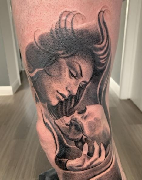 Black and Grey Woman and Skull Leg Tattoo