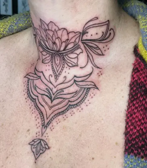 Symmetrical Floral Ornament Throat Tattoo