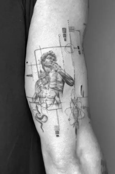 Historical Patchwork Inner Biceps Tattoo
