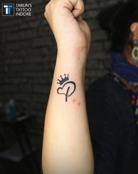 Initial Letter P with Stars and Crown Forearm Tattoo