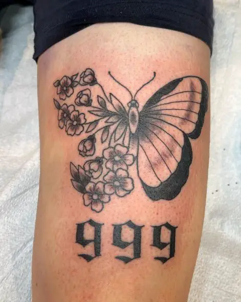 Black and Grey Butterfly with Flowers and 999 Tattoo