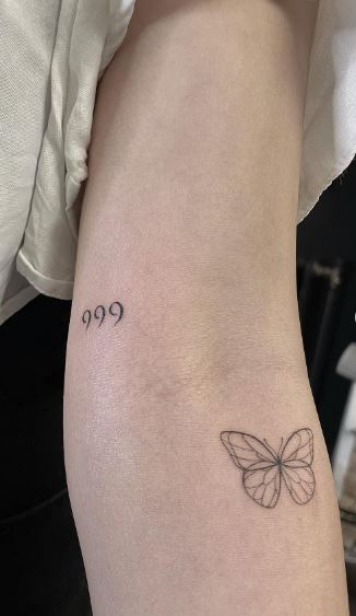 Minimalistic Butterfly and 999 Arm Tattoo