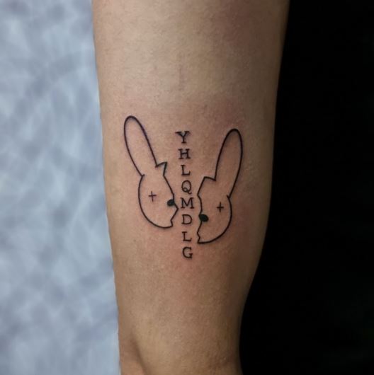 Broken Bad Bunny Logo and YHLQMDLG Arm Tattoo