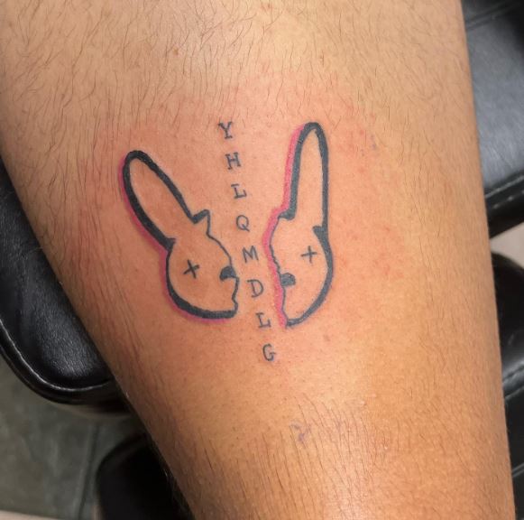 Broken Bad Bunny Logo and YHLQMDLG Leg Tattoo