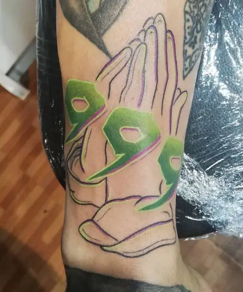 Praying Hands and Green 999 Tattoo