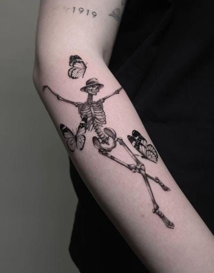 Butterflies and Dancing Skeleton Forearm Tattoo