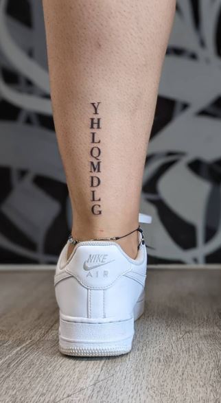 Vertical YHLQMDLG Calf Tattoo