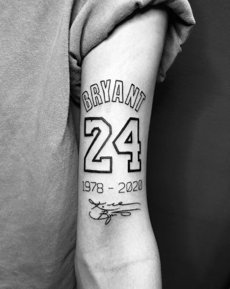 Bryant with No. 24 and Years Stamp Memorial Biceps Tattoo