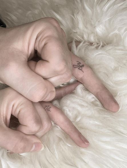 Handwritten Initial Letters Matching Finger Tattoos