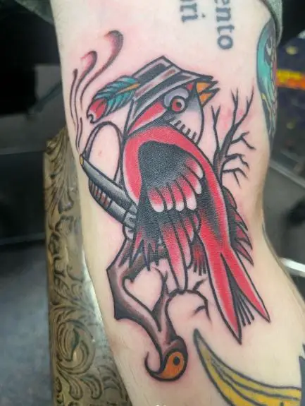 Traditional Smoking Gun and Cardinal Arm Tattoo