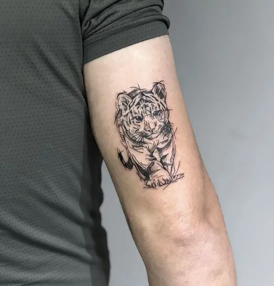 Sketched Black and Grey Lion Cub Arm Tattoo