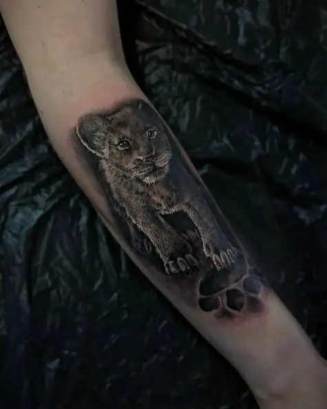 Lion Footprint and Lion Cub Forearm Tattoo