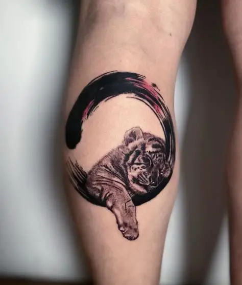 Enso Circle and Sleeping Tiger Cub Leg Tattoo