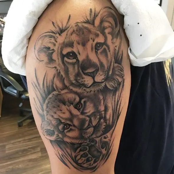Black and Grey Two Lion Cubs Arm Tattoo