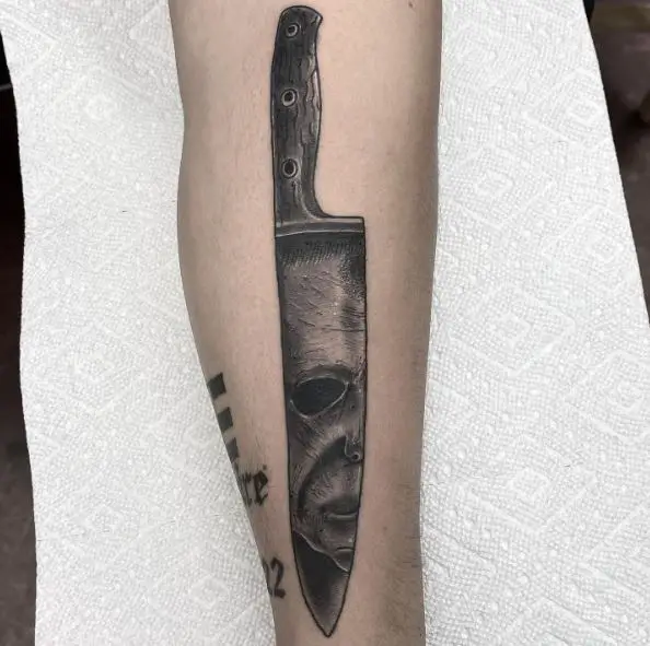 Michael Myers Face on Knife Blade Forearm Tattoo