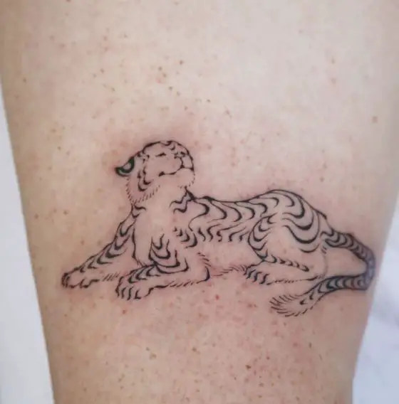 Lying Minimalistic Tiger Arm Tattoo