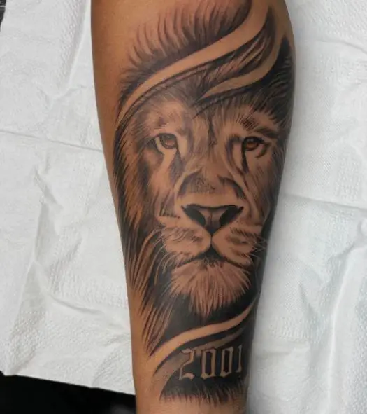 Black and Grey Lion Head with Year 2001 Forearm Tattoo