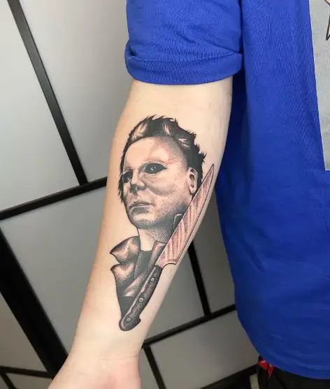 Shaded Michael Myers and Bloody Knife Forearm Tattoo