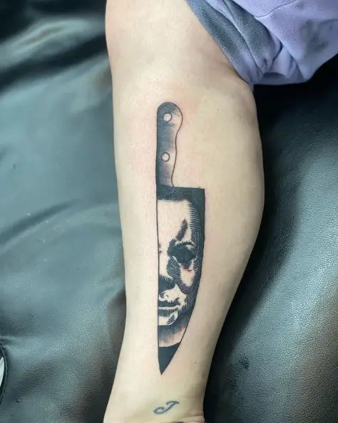 Michael Myers Face on Knife Blade Calf Tattoo