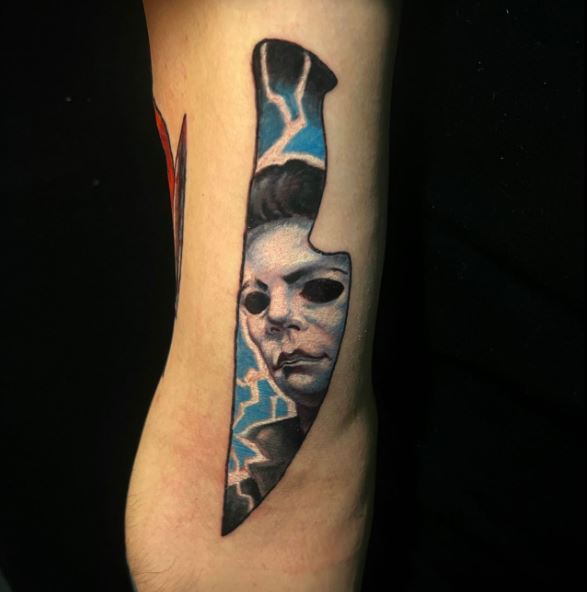 Colorful Knife, with Michael Myers Face on Blade Arm Tattoo
