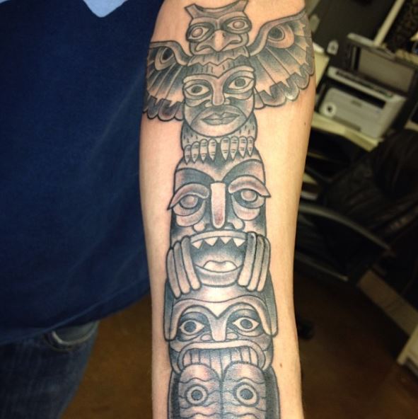 Grey Shaded Native American Totem Pole Forearm Tattoo