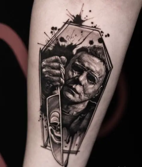 Black and Grey Michael Myers with Knife Forearm Tattoo