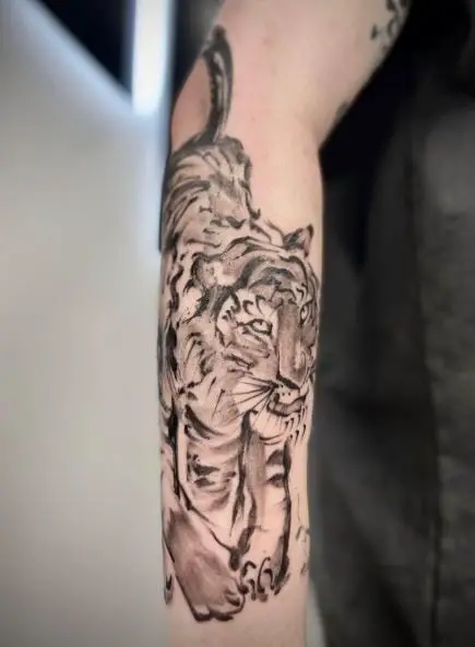 Black and Grey Crouched Tiger Forearm Tattoo