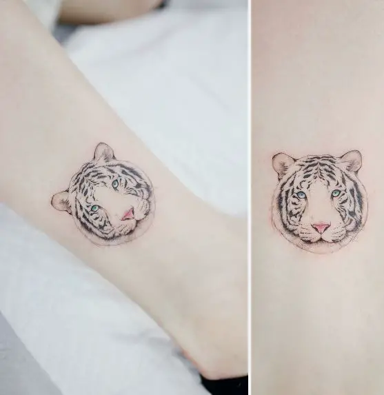 Minimalistic White Tiger with Blue Eyes Ankle Tattoo