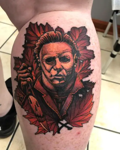 Leaves and Michael Myers with Knife Calf Tattoo