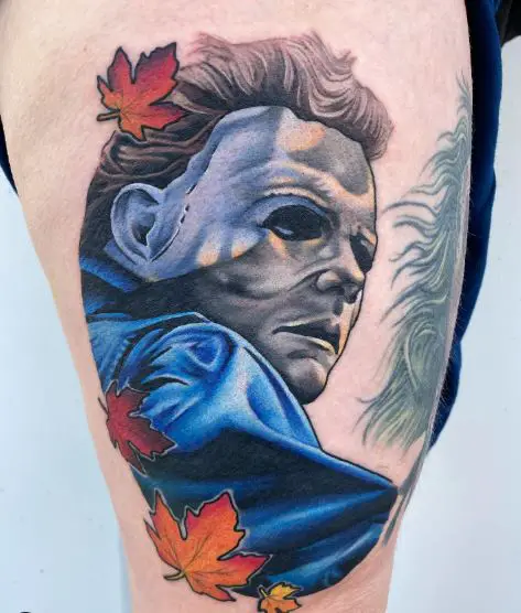 Colorful Fallen Leaves and Michael Myers Thigh Tattoo