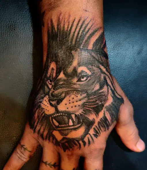 Black and Grey Roaring Lion Hand Tattoo