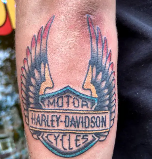 Colorful Harley Davidson Medallion with Wings Forearm Tattoo