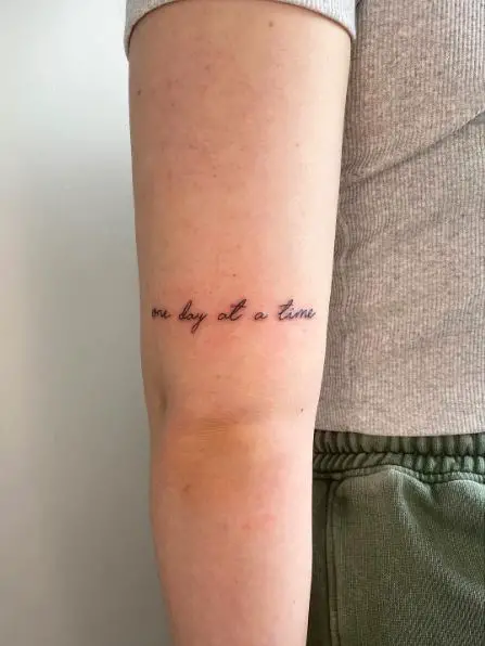 Minimalistic One Day at a Time Sobriety Arm Band Tattoo