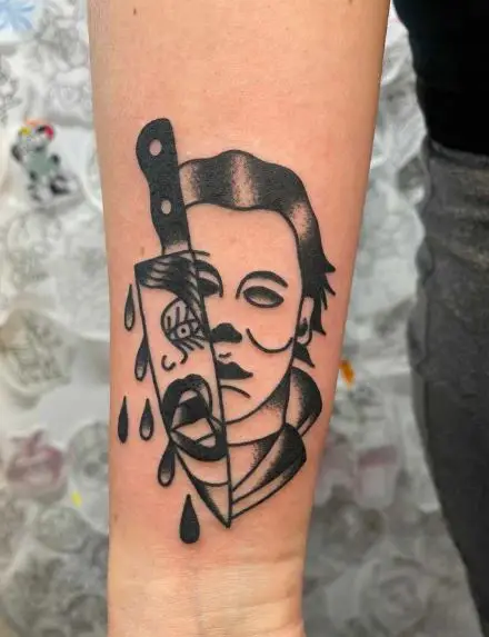 Michael Myers and Knife with Laurie Strode Face on Blade Forearm Tattoo