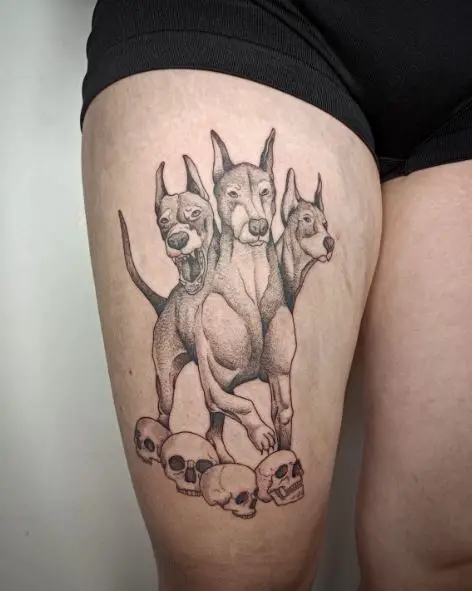 Skulls and Cerberus Thigh Tattoo