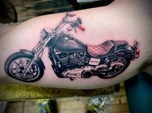 Black and Grey Harley Davidson Motorcycle with Red Seat Inner Biceps Tattoo