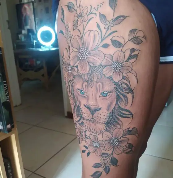 Grey Flowers and Lion with Blue Eyes Thigh Tattoo