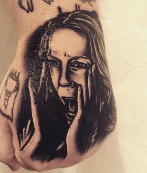 Black and Grey Laurie Strode Screaming Hand Tattoo