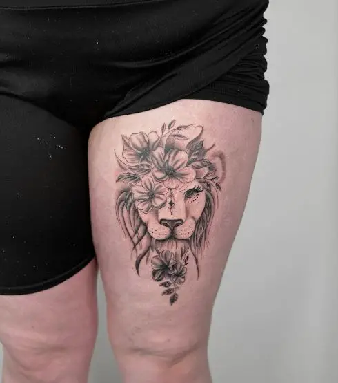 Grey Shaded Flowers and Lion Thigh Tattoo