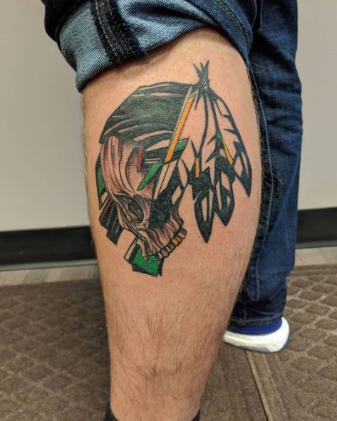 Sioux Skull with Feathers Leg Tattoo