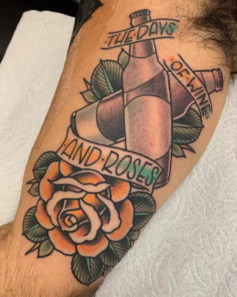 Rose and Bottles Sobriety Biceps Tattoo