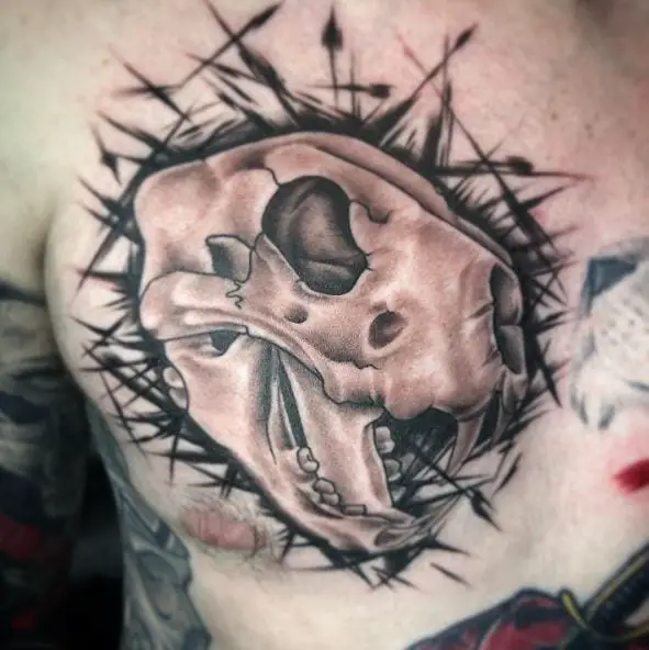 Black and Grey Thorns and Lion Skull Chest Tattoo