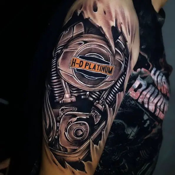 Ripped Skin and Harley Davidson Engine Arm Tattoo