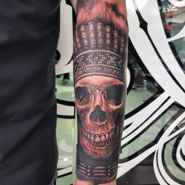 Skull with Apache Feather Headdress Forearm Tattoo
