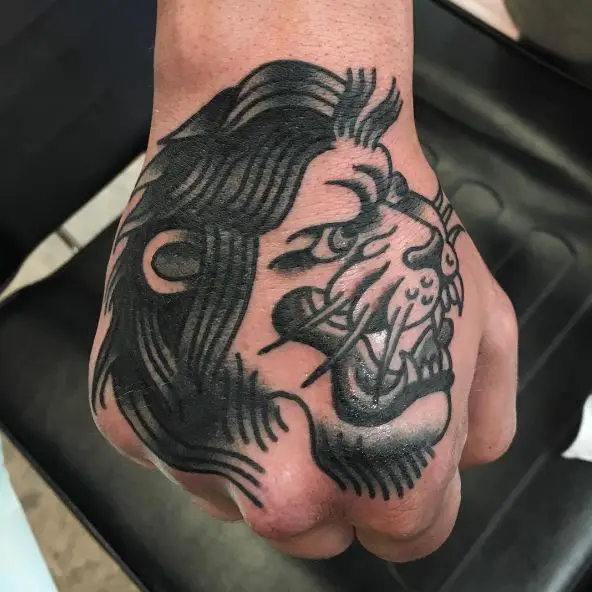Black and Grey Traditional Lion Hand Tattoo