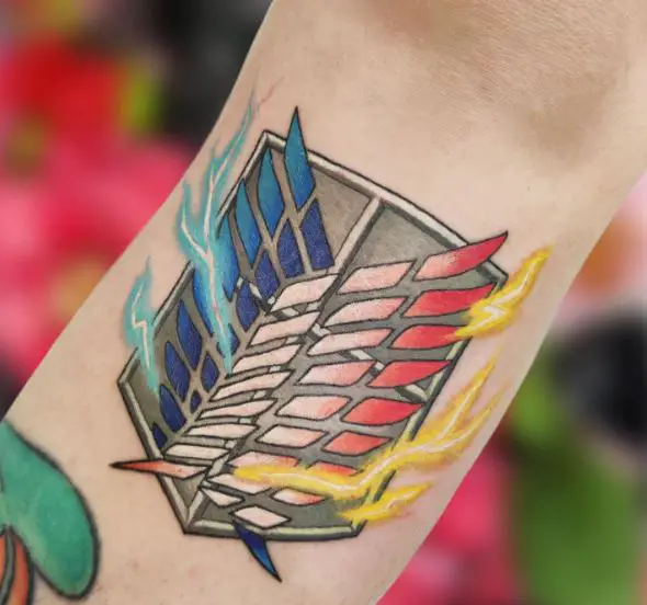 Colorful Electrifying Attack on Titan Logo Forearm Tattoo
