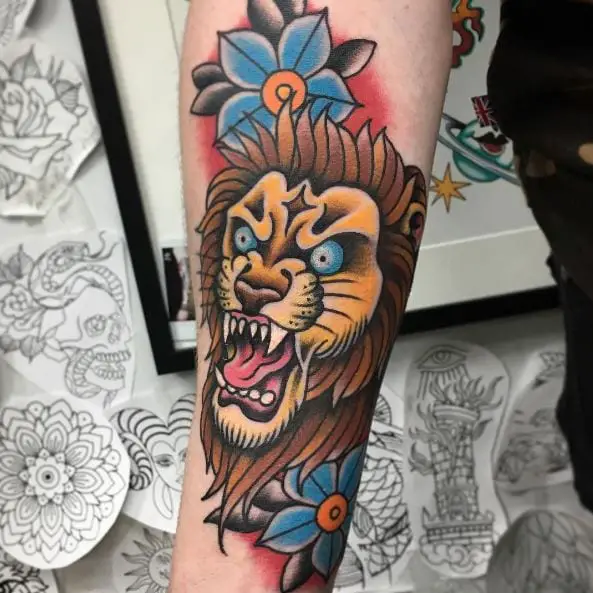 Blue Flowers and Colorful Traditional Lion Forearm Tattoo