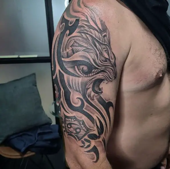Black and Grey Tribal Lion Arm Tattoo
