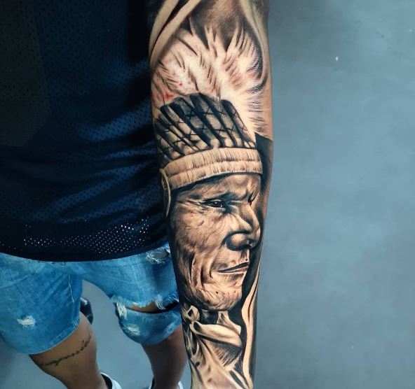 Black and Grey Indian Chief with Feather Headdress Arm Tattoo