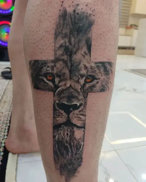 Black and Grey Cross Framed Lion Leg Tattoo